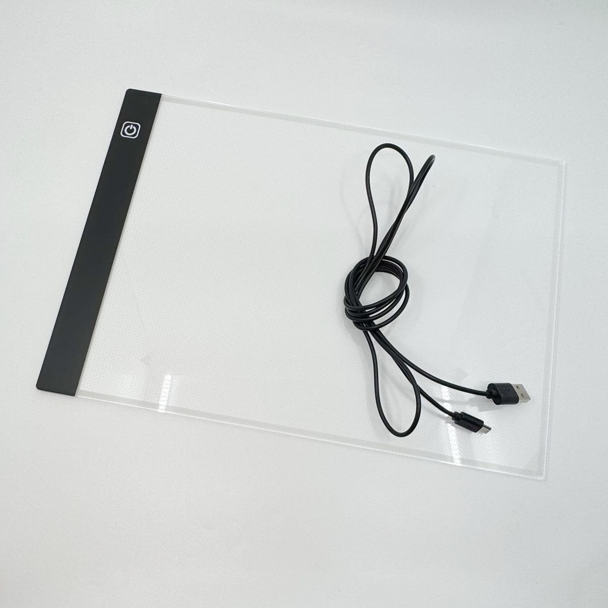 A4 light pad in use tracing a design