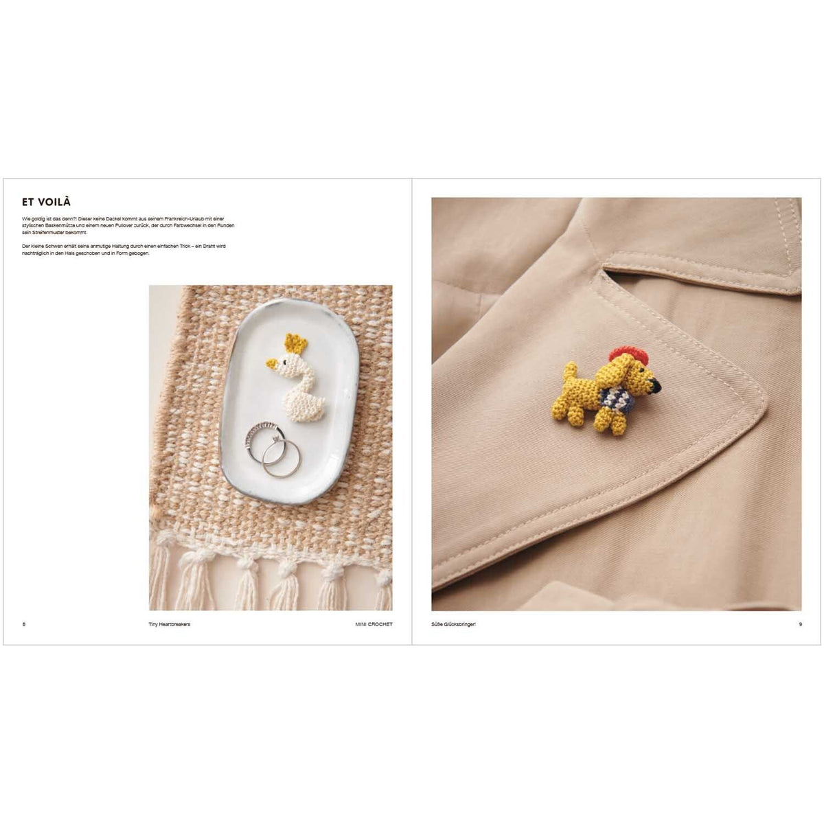 Weiße gehäkelte Enten-Anhänger und gelber Hund-Brooch an Mantel