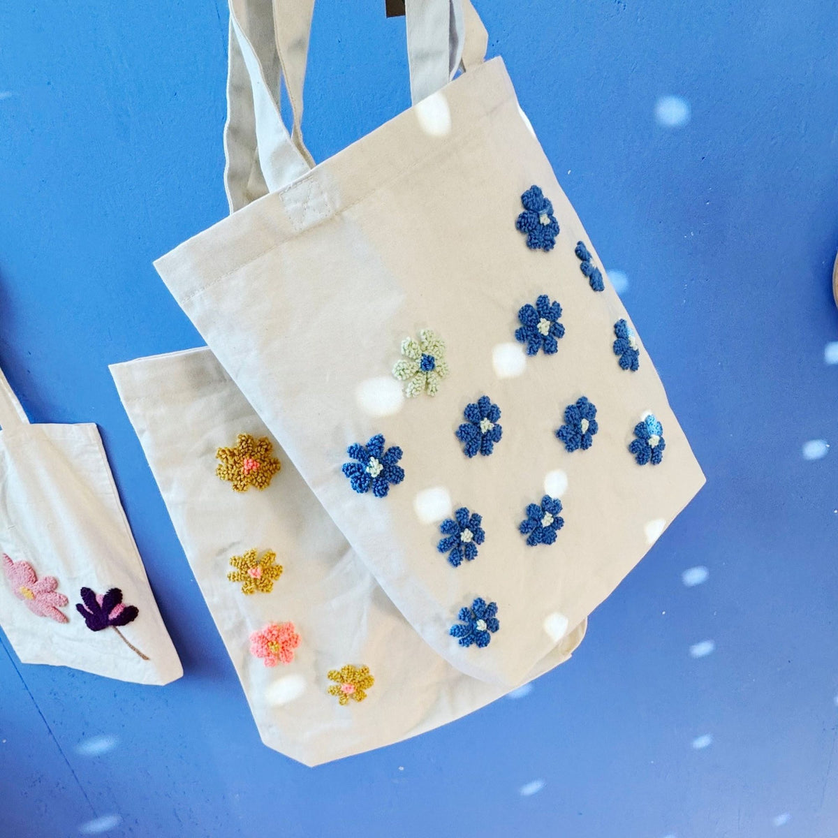 Floral punch needle bag with finished design detail