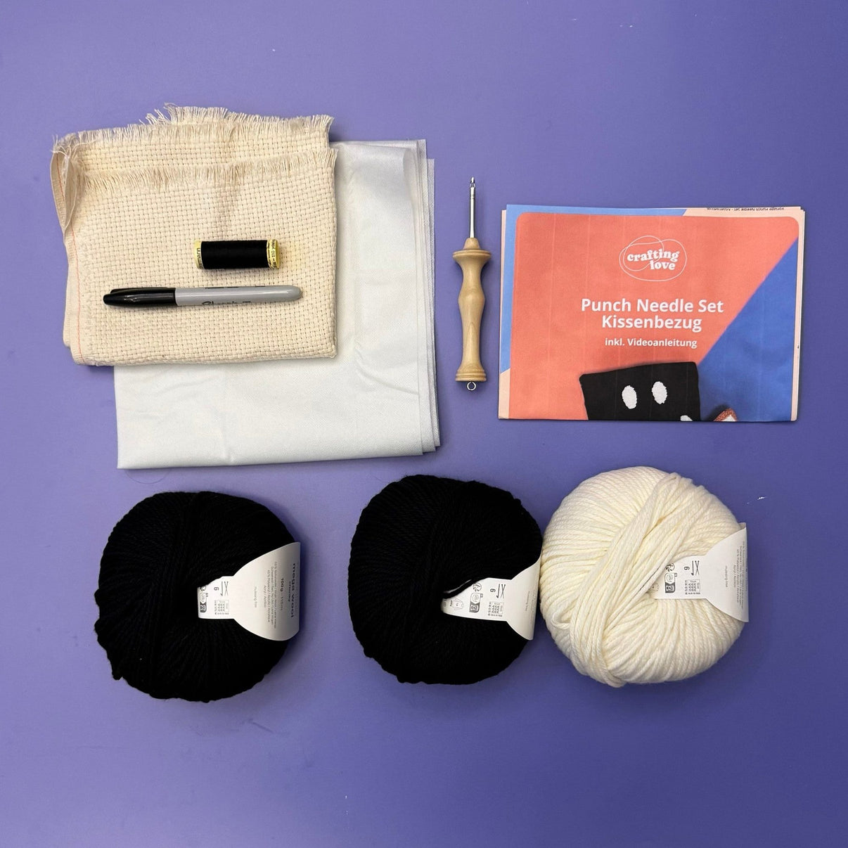 Punch needle pillowcase kit components laid out