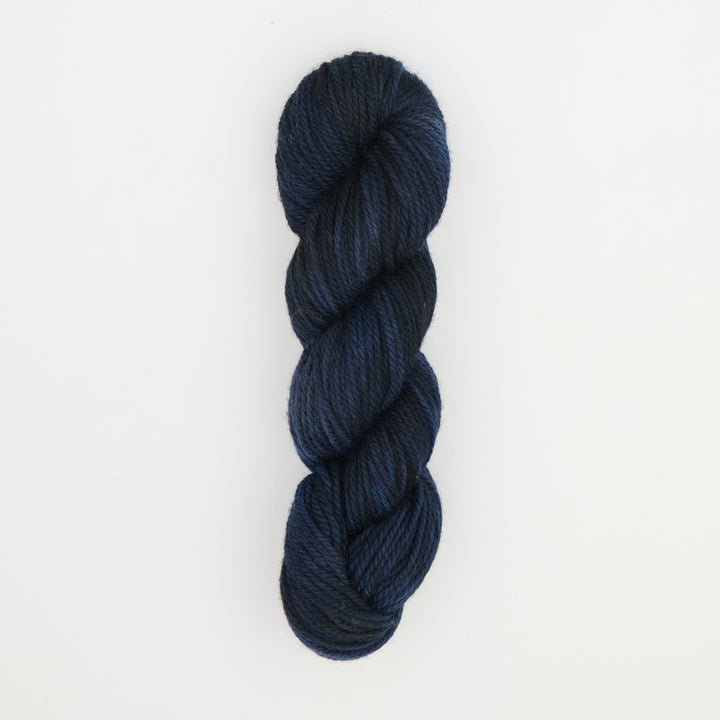 Fine punch needle yarn swatch in Blackbird variegated colours