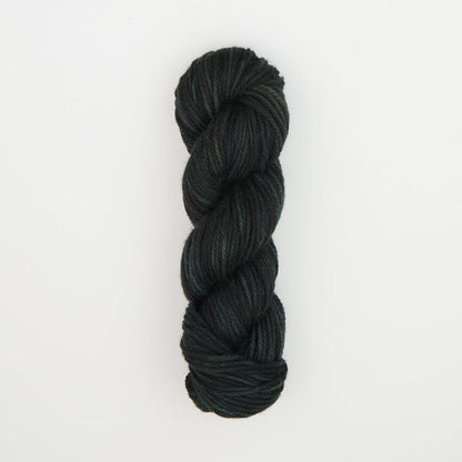 Fine punch needle yarn swatch in Black Green Velvet variegated colours