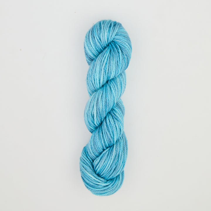 Fine punch needle yarn swatch in Antigua variegated colours