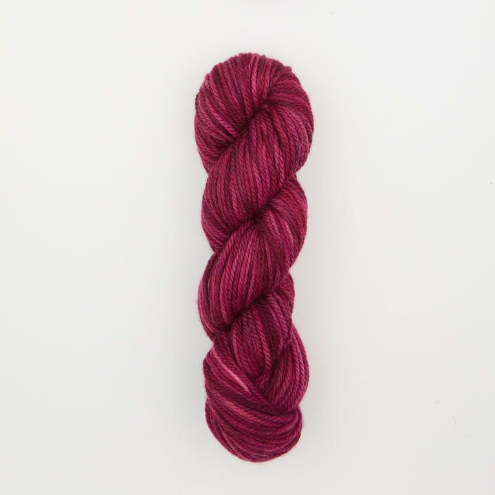 Fine punch needle yarn swatch in Black Raspberry variegated colours