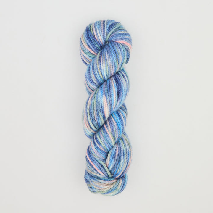Fine punch needle yarn swatch in Blue Christmas variegated colours
