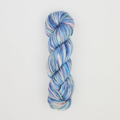 Fine punch needle yarn swatch in Blue Christmas variegated colours