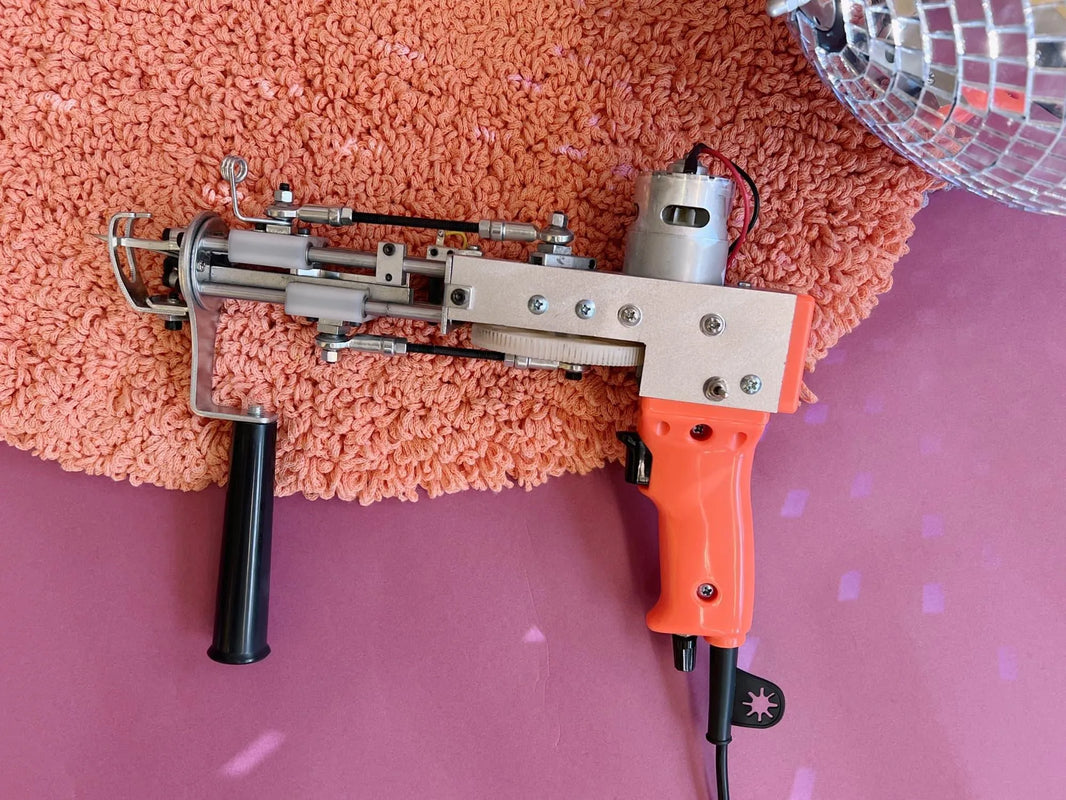 AK-I Cut Pile tufting machine in bright orange